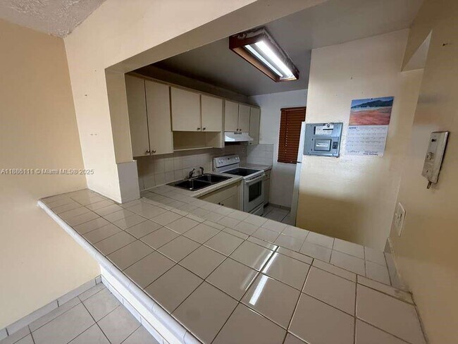 Building Photo - 6055 W 19th Ave Unit 410 Rental
