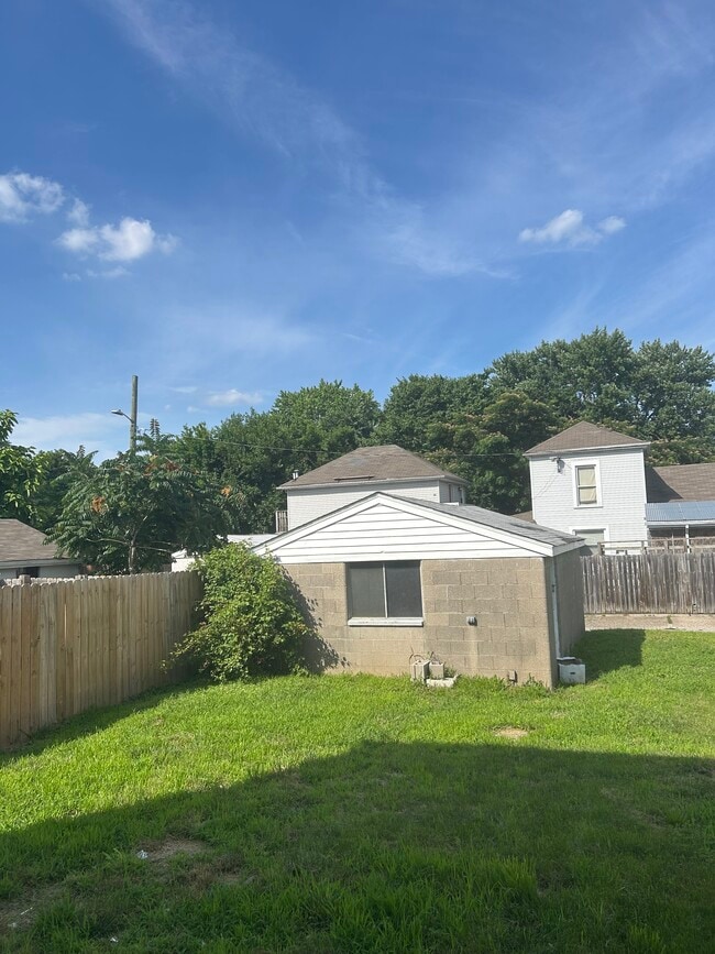 backyard, one car garage with opener, and parking for one car to the right - 2141 Bradley Ave