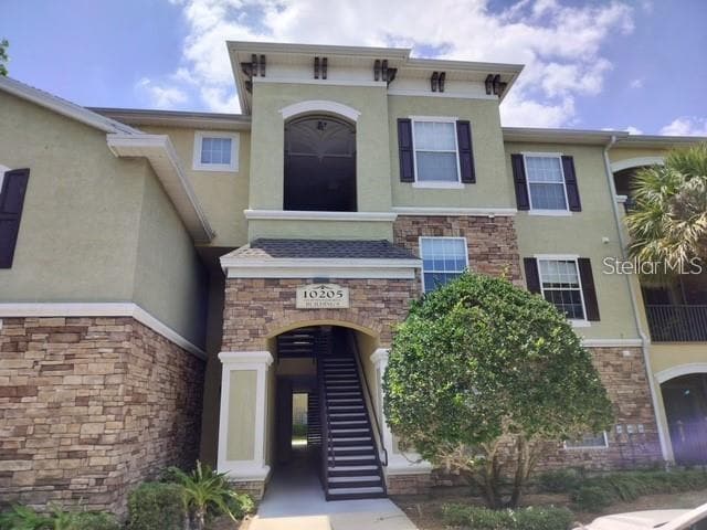 Building Photo - 10205 Courtney Palms Blvd Unit 101