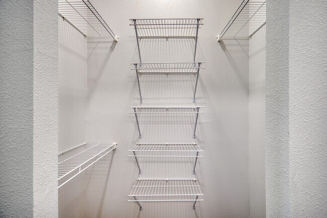 Spacious closet with convenient built-in storage at Residence at Pearsall Park