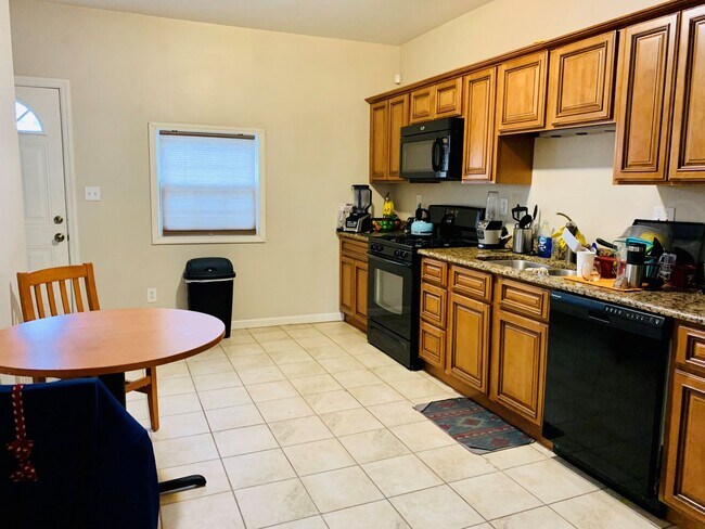 Photo - 2 Bedroom Home on Pius St Available April 1- Parking included.  Central Air.  Washer and Dryer.