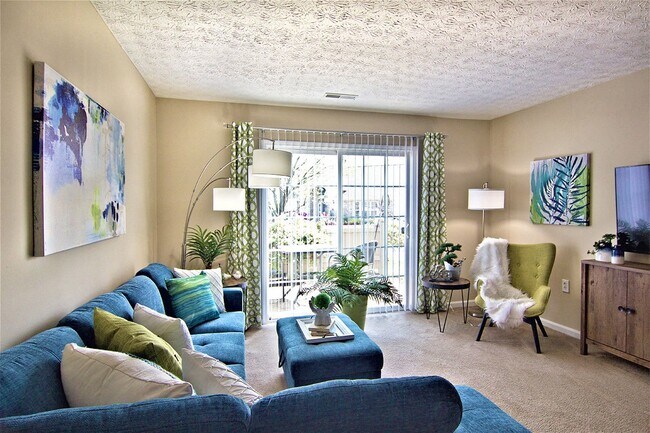 Cozy living room with natural light and seating - Cumberland Links