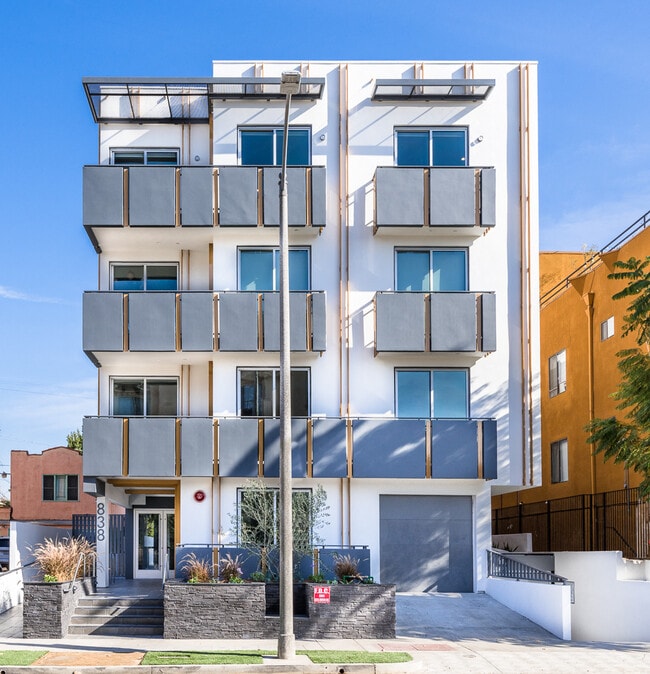 Living Room with Recessed Lighting, Vinyl Flooring, and Patio - The Hudson by Wiseman