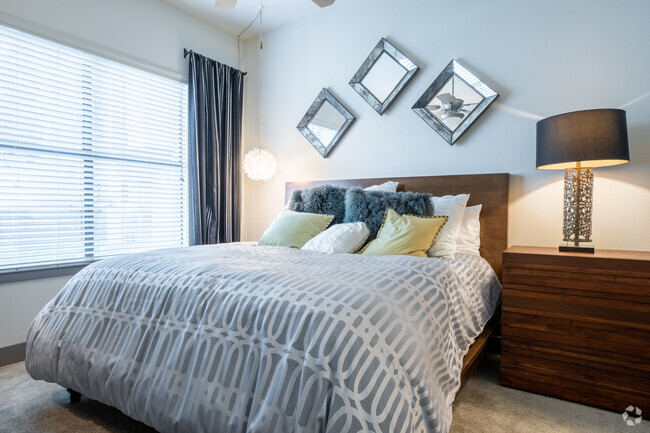 Carpeted bedrooms - Bridge at Midtown Commons Apartments