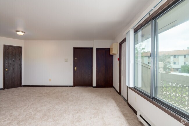 2BR, 1BA - 766SF - Living Room - Sunset Apartments