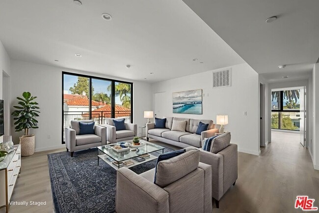 Building Photo - 3755 S Canfield Ave Unit 301