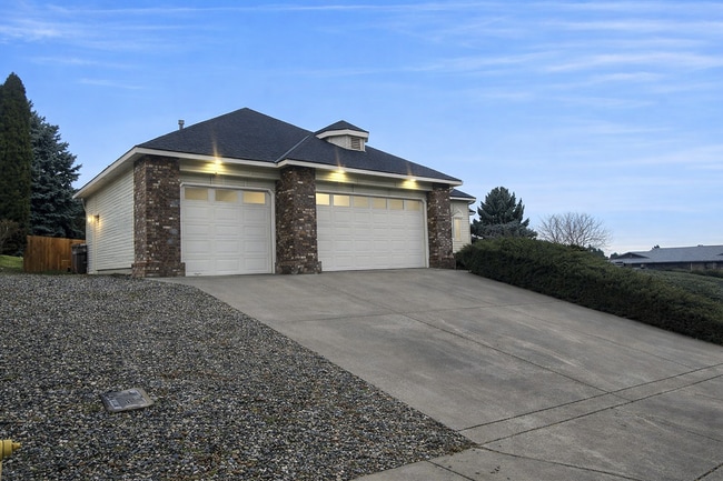 Photo - Executive 3 Bed Home with 3 Car Garage & Private Fenced Yard