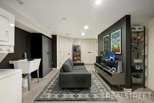 Photo - Modern Bushwick 2-bedroom, 2.5-bath duplex with private garden, deck, and finished recreation room —