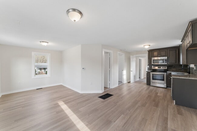 Photo - This cozy residence features a bright living space and well-appointed kitchen.  1st month is FREE...