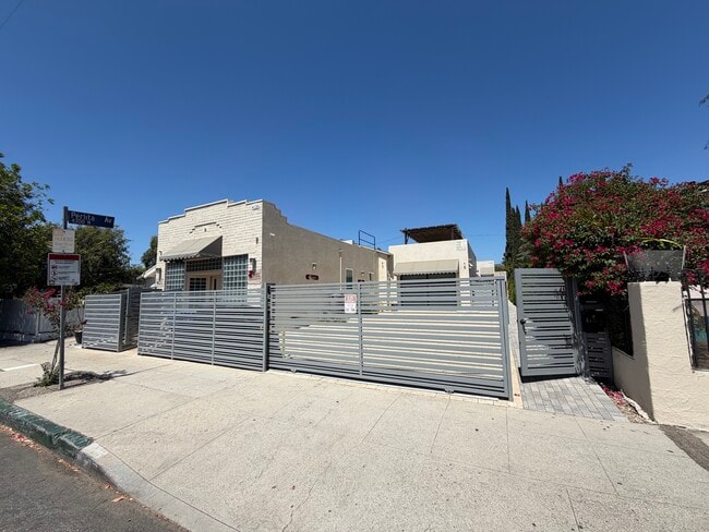 view from street of property. House is in middle of property