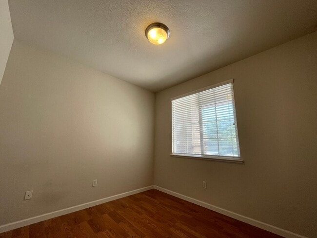 Photo - Fireplace in Living Room, Backyard Patio, Hardwood and Laminate Flooring