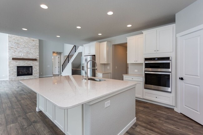 Photo - Exceptional 4-Bedroom Home with Dual Fireplaces, Main Level Master Suite, and Spacious Basement -...