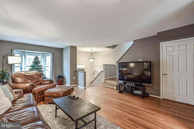 Living Room FURNISHED: w/ couch, coffee table, bar cart and TV stand - 3814 Usher Ct