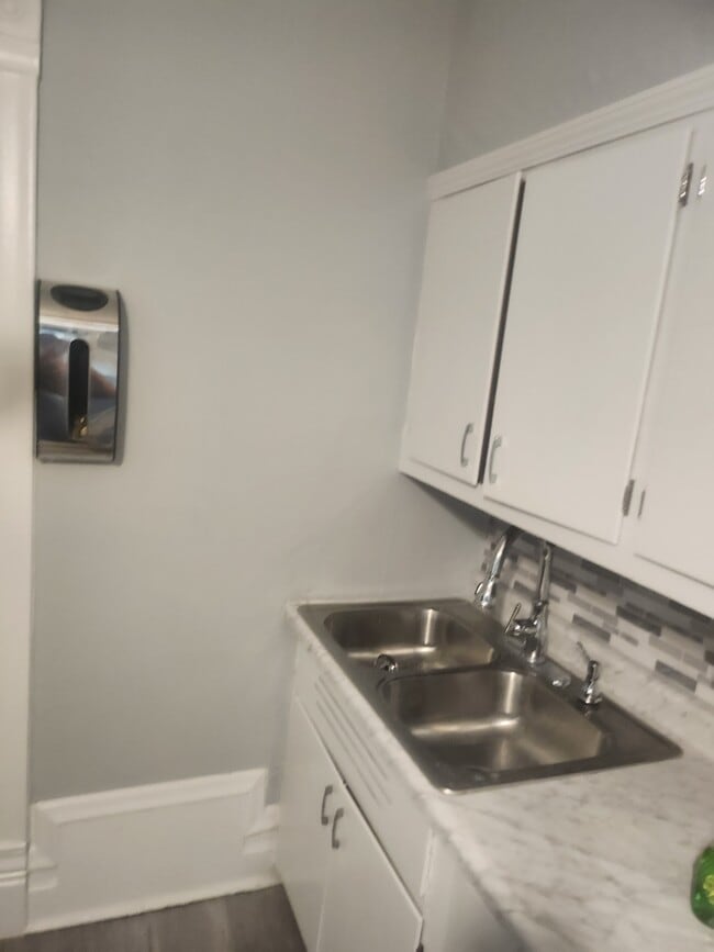 Kitchen with Gray wall and white cabinets - 238 N Lockwood Ave