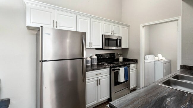 Love your heart of the home with our contemporary kitchens offering style and convenience. - Riverwood Apartments