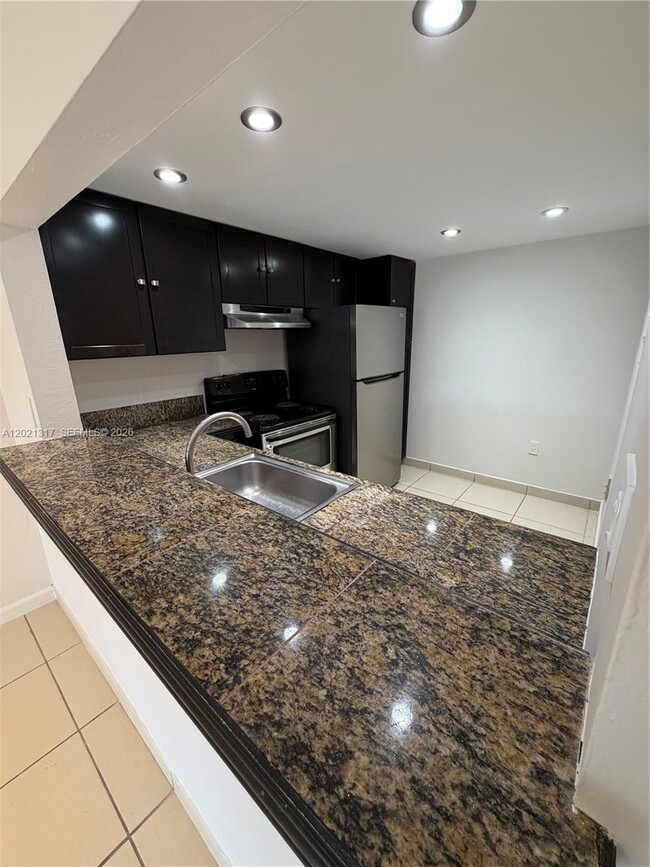 Building Photo - 11201 SW 88th St Unit 102A