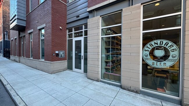 Entry is secure with entry code, security cameras and remote door unlocking. - 116 W 15th St Unit 303