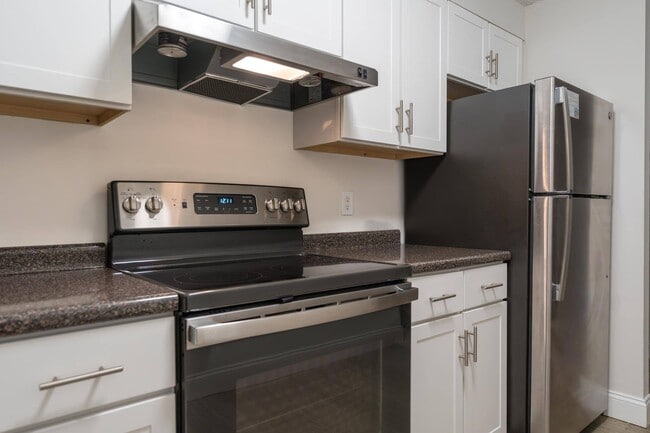 Modern kitchen style with updated white cabinetry and sleek stainless-steel appliances, creating a fresh, clean look.