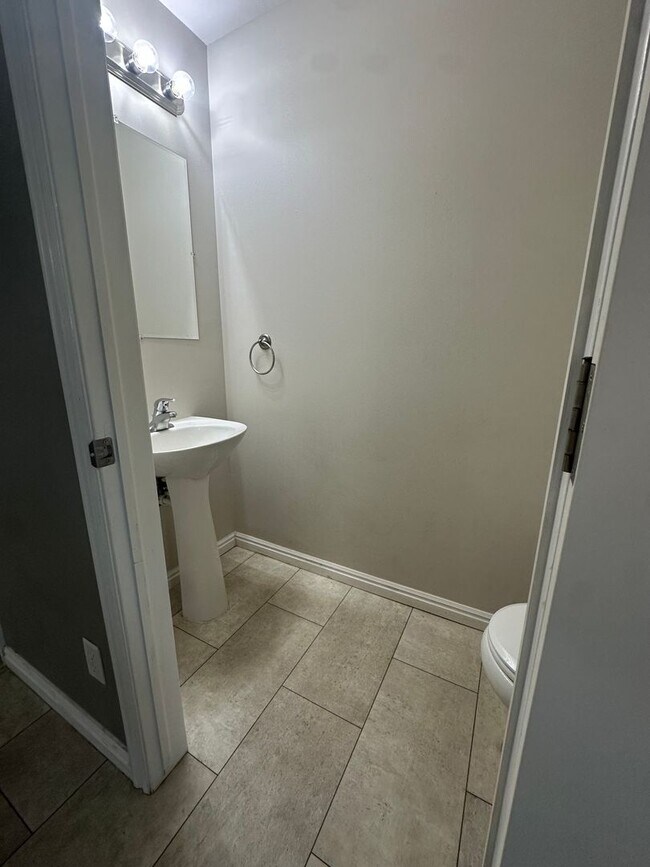 Photo - 2-Bedroom Townhome with Central AC and Covered Parking