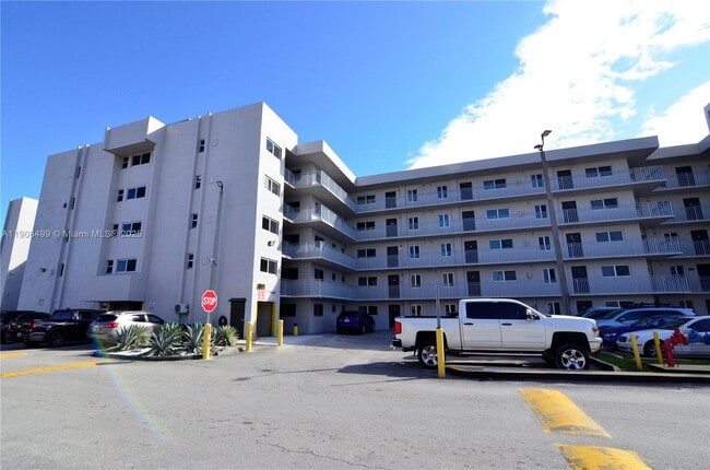 Building Photo - 9911 W Okeechobee Rd Unit 1-104