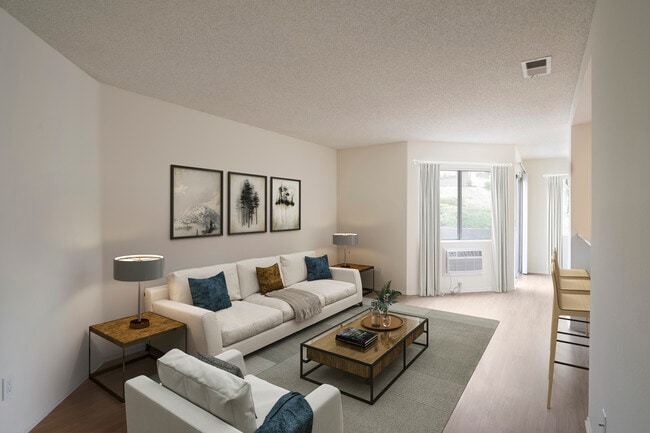 Renovated Package I living room with hard surface flooring