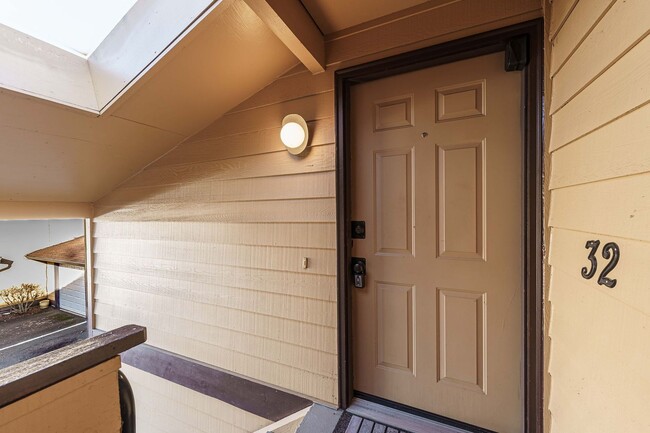 Photo - Updated 1 Bed / 1 Bath Upper-Level Condo with Balcony, Garage & A/C — Gated Community! Unit 32