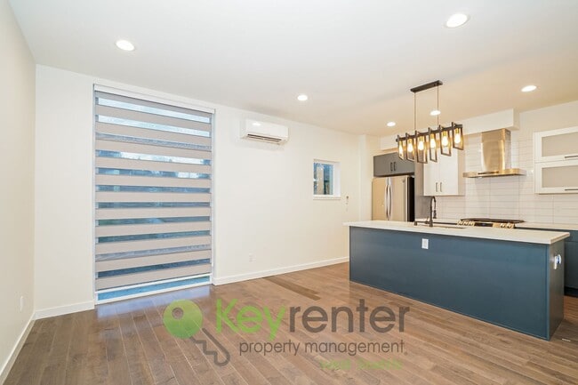 Photo - Rooftop Living with Open Concept Design and Parking Included