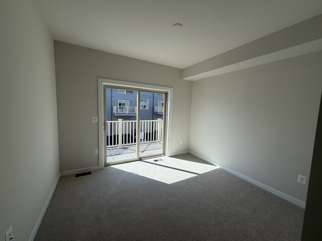 bed room 2 with balcony - 8652 Lovelace St Unit 155