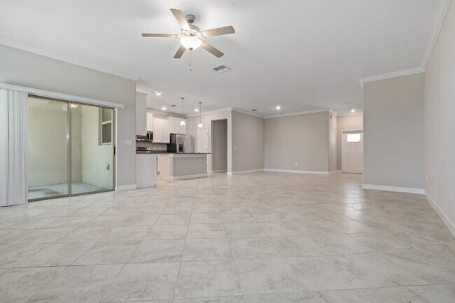 Photo - "Spacious 4-Bed Oasis with Granite Charm in Lutz!"In a gated community with 2 Cars garage