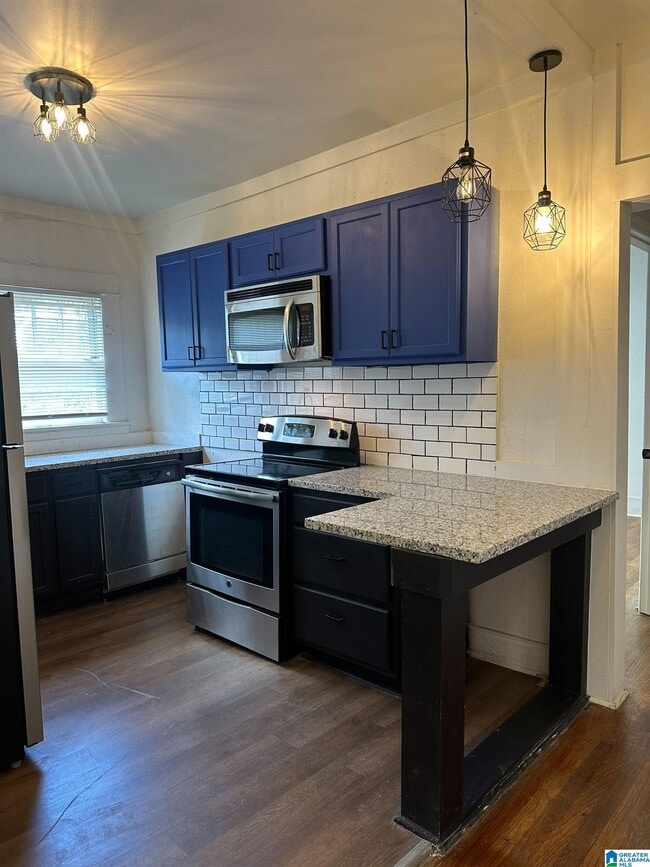 Building Photo - 1229 8th Ave W Unit A Rental