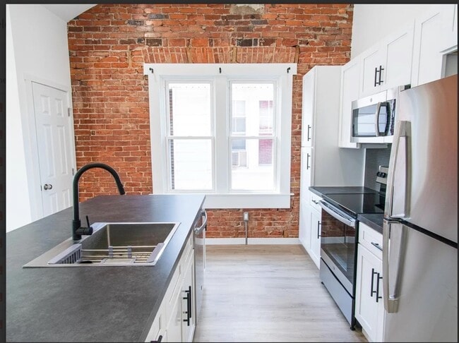 Kitchen with exposed brick - 1915 W Livingston St Unit #2