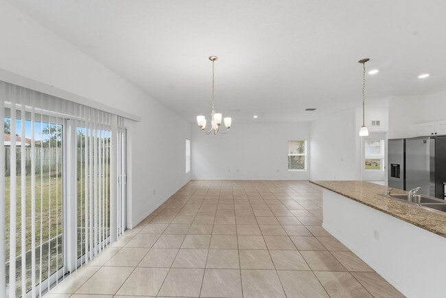 Photo - Modern New Construction 4BR/2BA Home for Rent in Palm Bay – Flexible No-Deposit Move-In Available