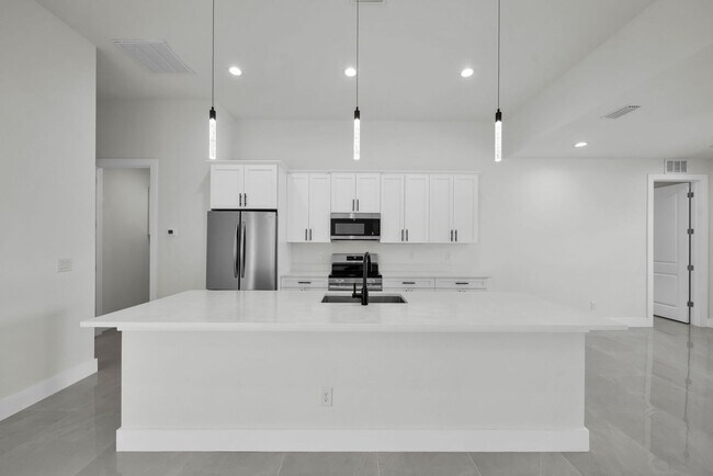 Photo - Single family for rent in Port Charlotte. New construction. 3+Den/ 2 bath. City water.