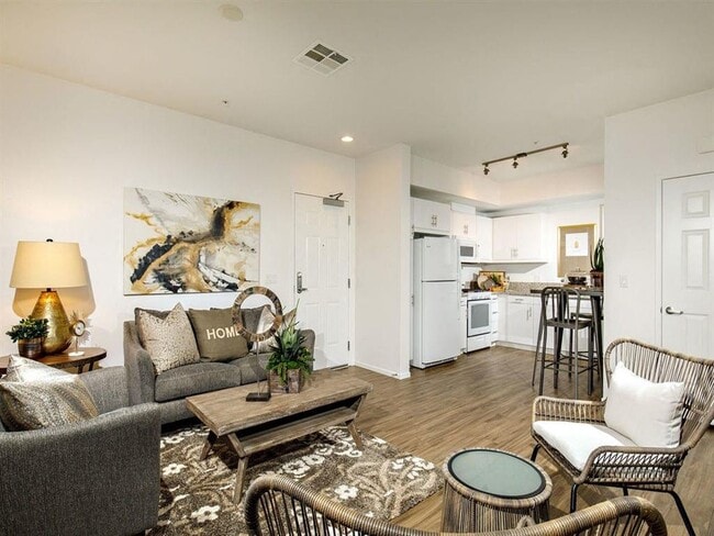 Open concept kitchen with the white refrigerator atove microwave cabinets - Stone Creek