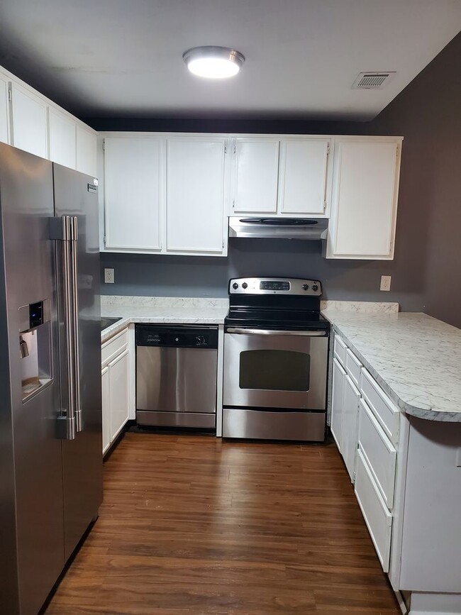 Photo - Dual Suite Comfort: 2BR/2BA Townhouse with Washer/Dryer Included