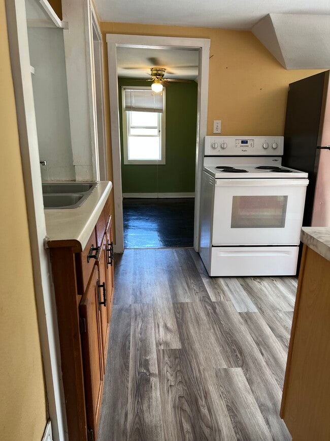 Kitchen with updated floor and energy-efficient fridge - 2432 Prais St