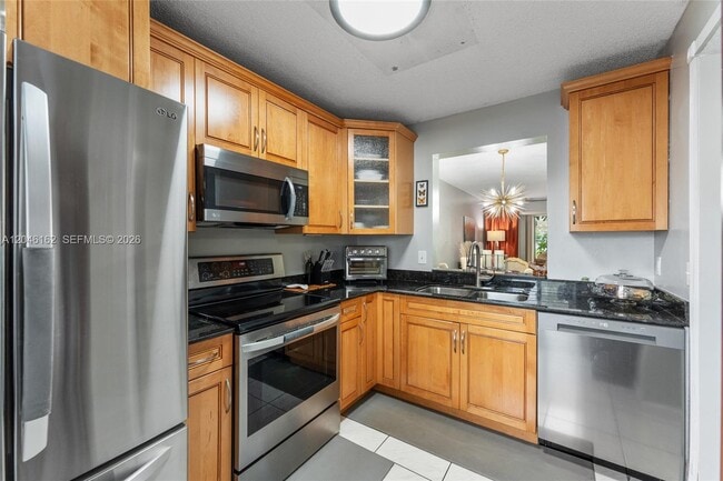 Building Photo - 8550 N Sherman Cir Unit 108