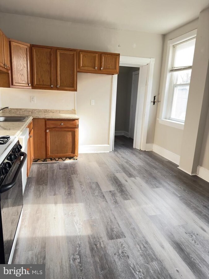 Photo - Spacious 5-Bedroom Home with Private Yard & Off-Street Parking in Upland