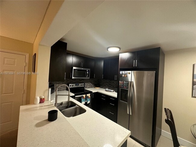 Photo - 9491 Palm Cir S Unit 202