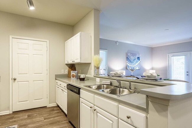 Experience the Seamless Blend of a Modern Kitchen and Cozy Living Space.
