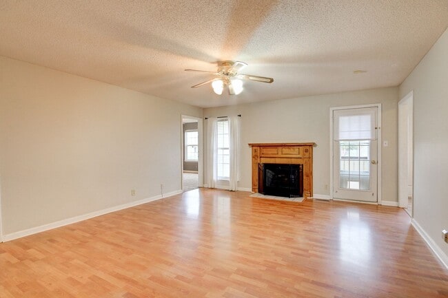 Photo - Amazing Home With Fireplace and Hardwood Flooring in Whitehall Subdivision