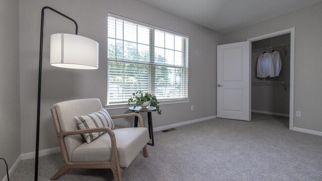 The second bedroom offers ultimate privacy, complete with its 'mini' walk-in closet.