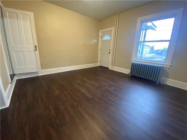 Photo - Charming three-bedroom row house available...
