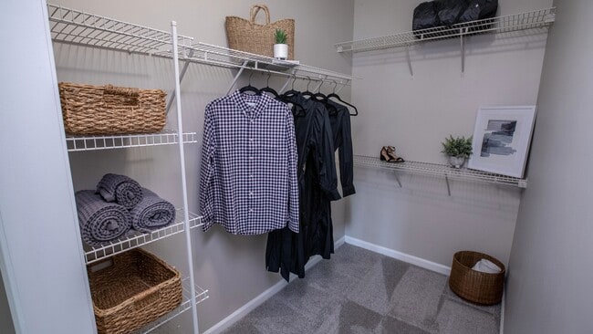 Our bedroom's walk-in closet is thoughtfully designed with long, staggered shelves to accommodate your wardrobe with ease!