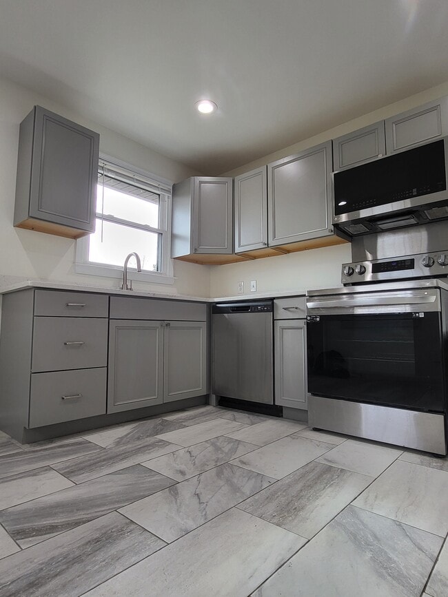 Cocina con encimera de granito - 1512A Sweetbriar Ave Unidad A