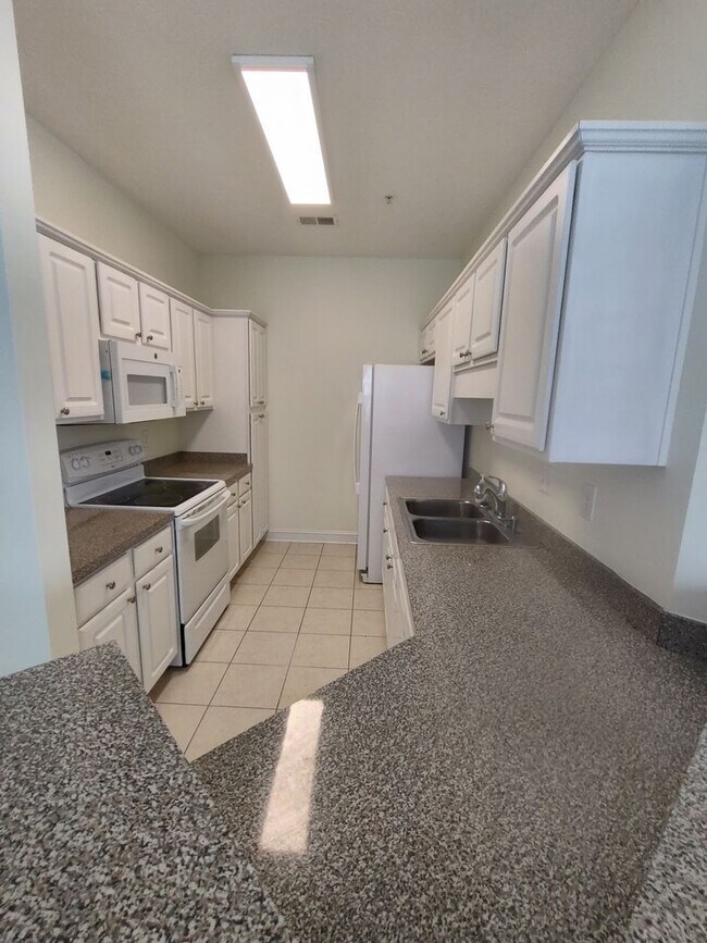 Photo - MOVE IN READY! 3rd Floor Condo with BEAUTIFUL Pond View! Central Location!