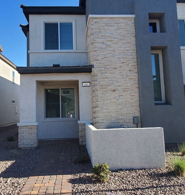 Building Photo - Contemporary townhome with modern exterior and attached garage.