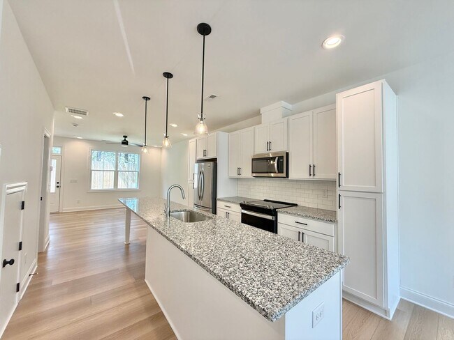 Photo - **OFFERING $125 RENT DISCOUNT FOR FIRST 6 MONTHS** Newly Built 4BD, 3.5BA Raleigh Townhome in a G...