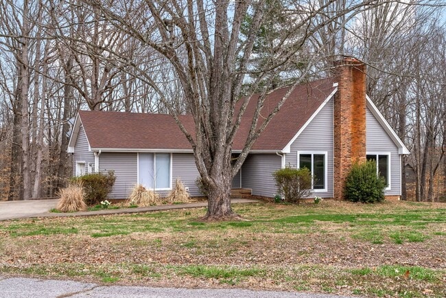 Building Photo - Lovely home on beautiful, wooded corner - Just Reduced
