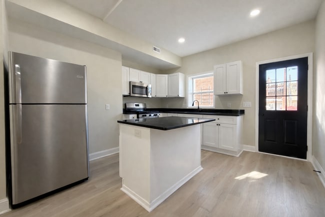 Photo - Modern 3BR Rowhome with Finished Lower Level & Rear Deck